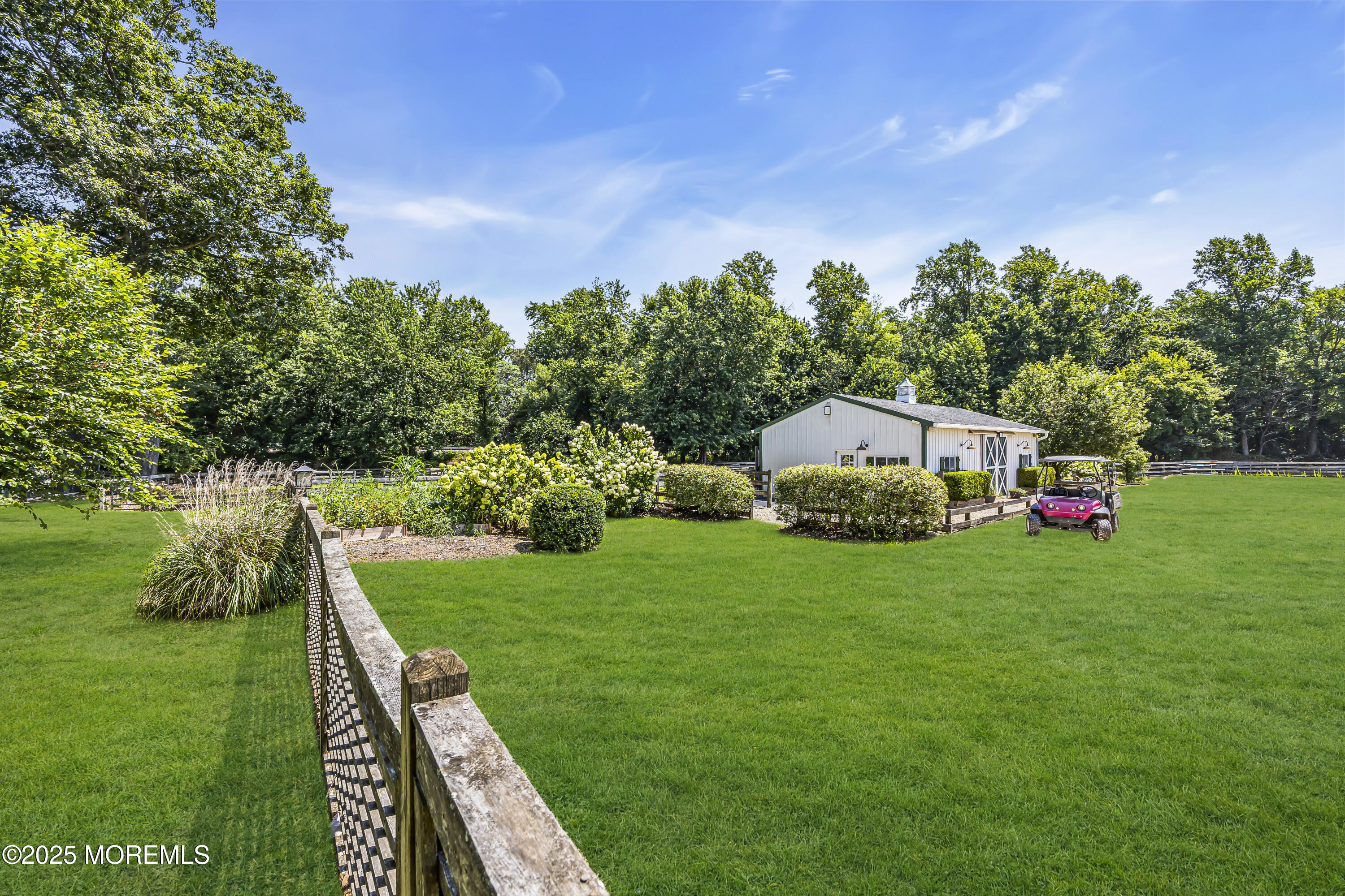 39 Hockhockson Road Colts Neck, NJ 07722 - Photo 54 of 72 a backyard of a house with lots of green space and fountain