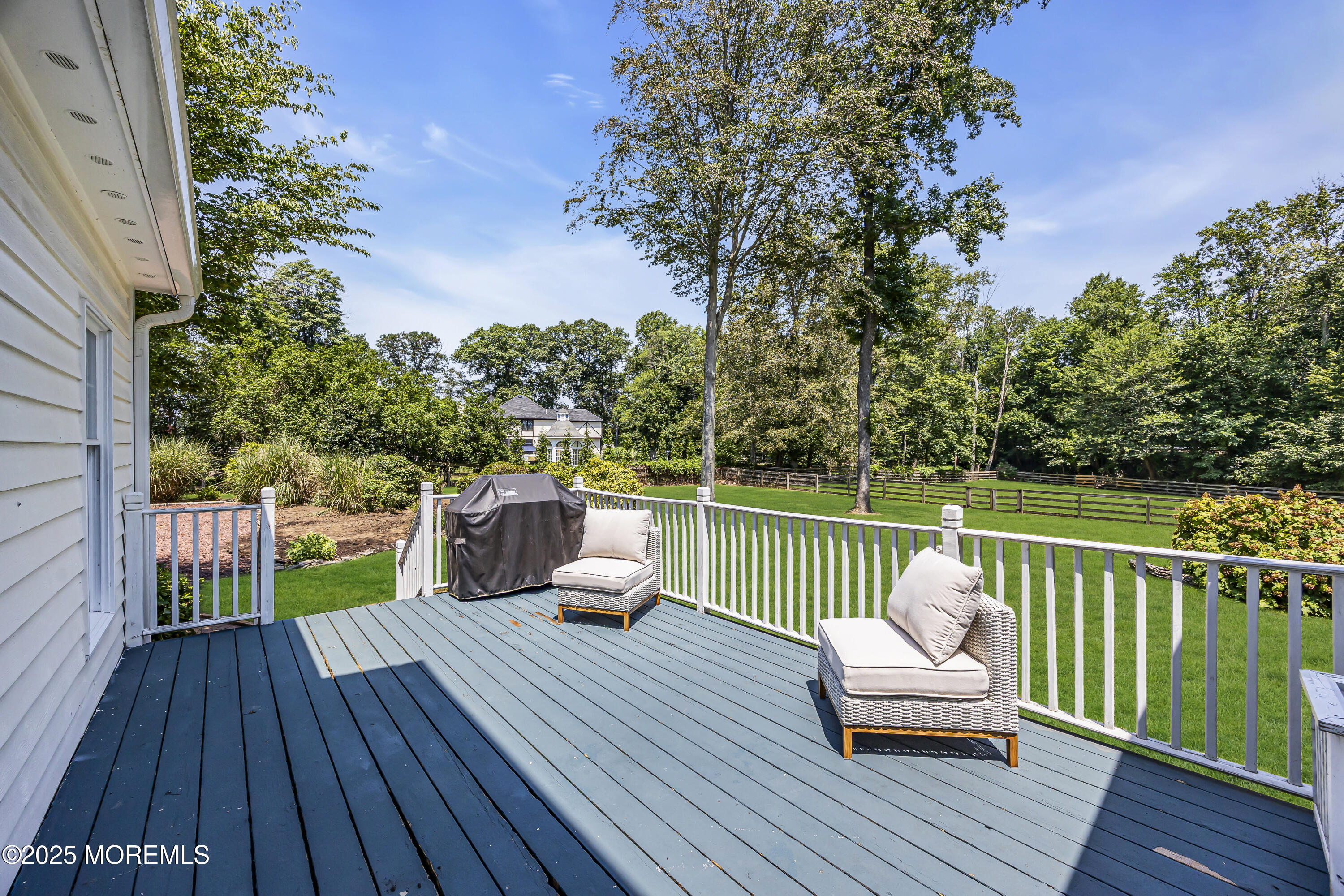 39 Hockhockson Road Colts Neck, NJ 07722 - Photo 55 of 72 a view of a deck with wooden floor and furniture