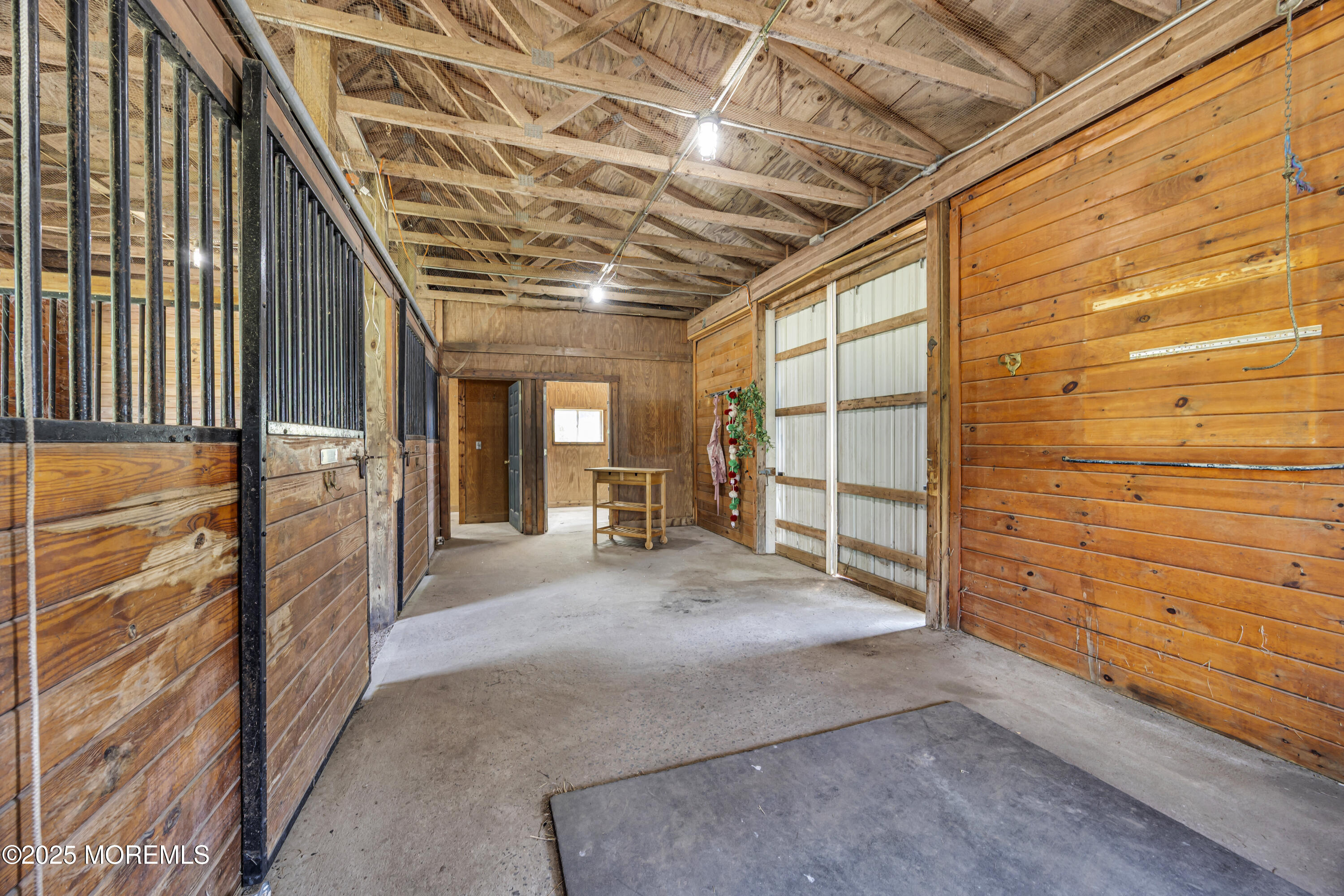 39 Hockhockson Road Colts Neck, NJ 07722 - Photo 59 of 72 a view of a porch with a wooden fence
