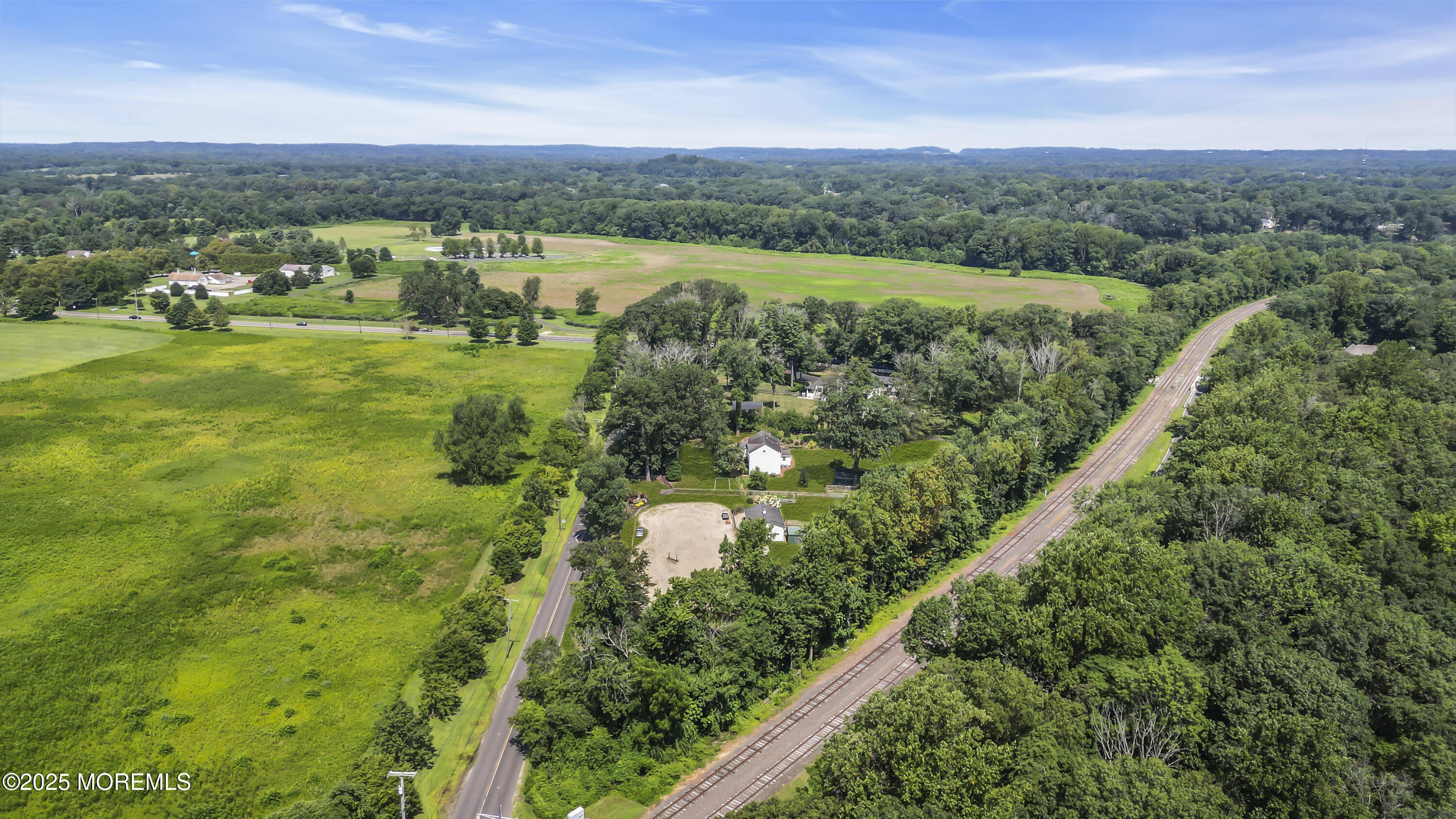 39 Hockhockson Road Colts Neck, NJ 07722 - Photo 71 of 72 a view of a city with lush green forest