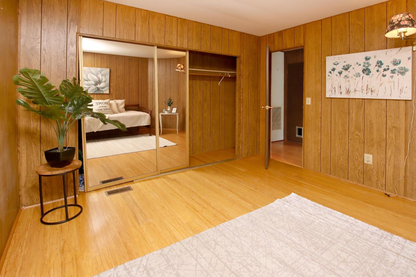 800 Dolan Road, Unit 22 Moss Landing, CA 95039 - Photo 15 of 29 a bedroom with a bed and ceiling fan