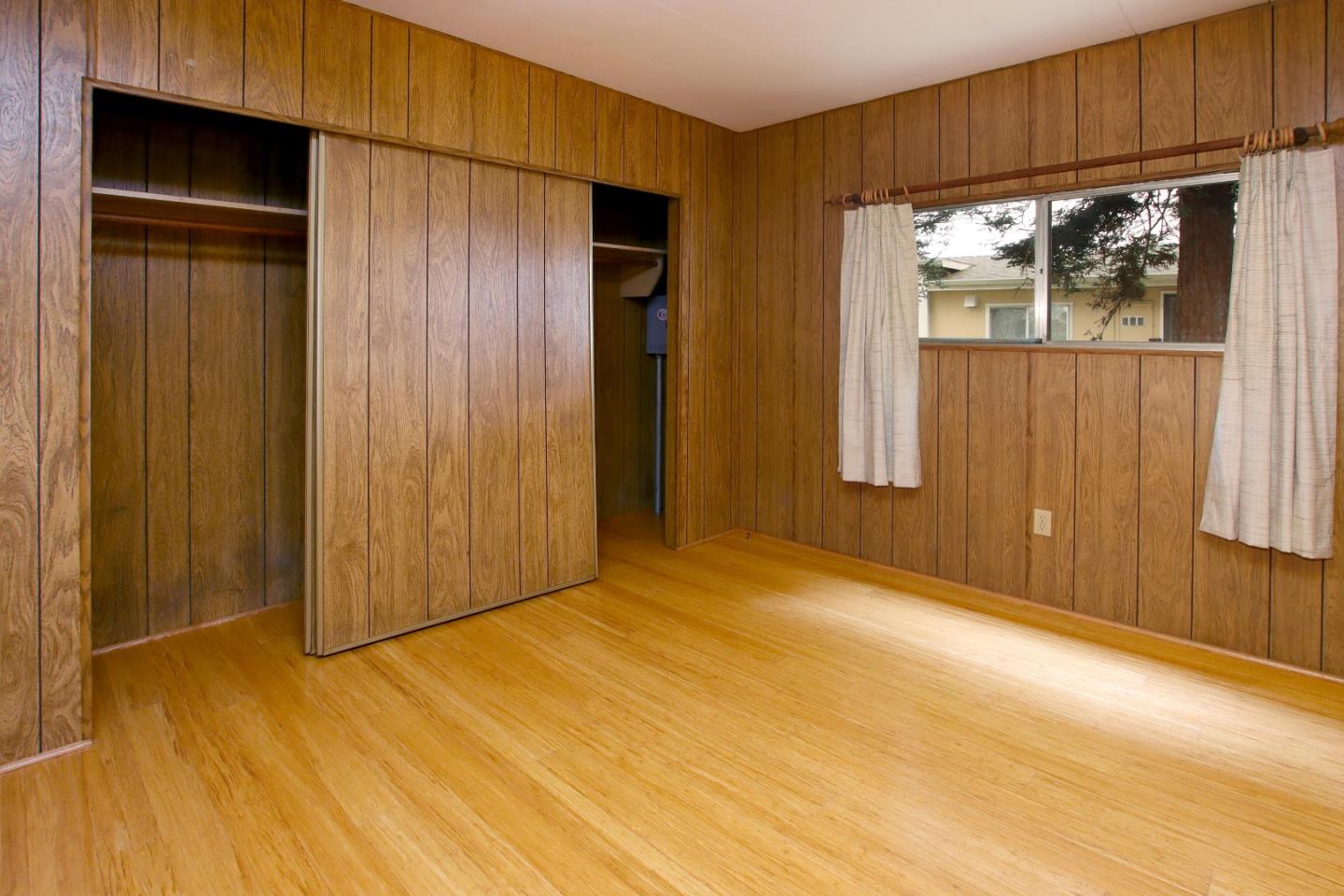 800 Dolan Road, Unit 22 Moss Landing, CA 95039 - Photo 18 of 29 an empty room with wooden floor and windows