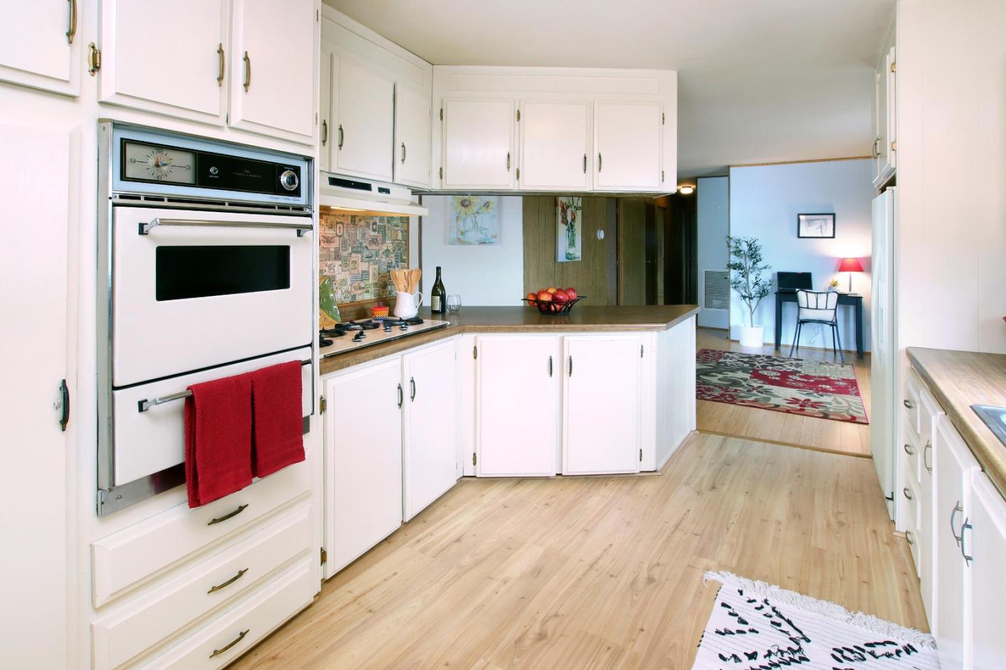 800 Dolan Road, Unit 22 Moss Landing, CA 95039 - Photo 7 of 29 a kitchen with stainless steel appliances a stove a microwave and a refrigerator