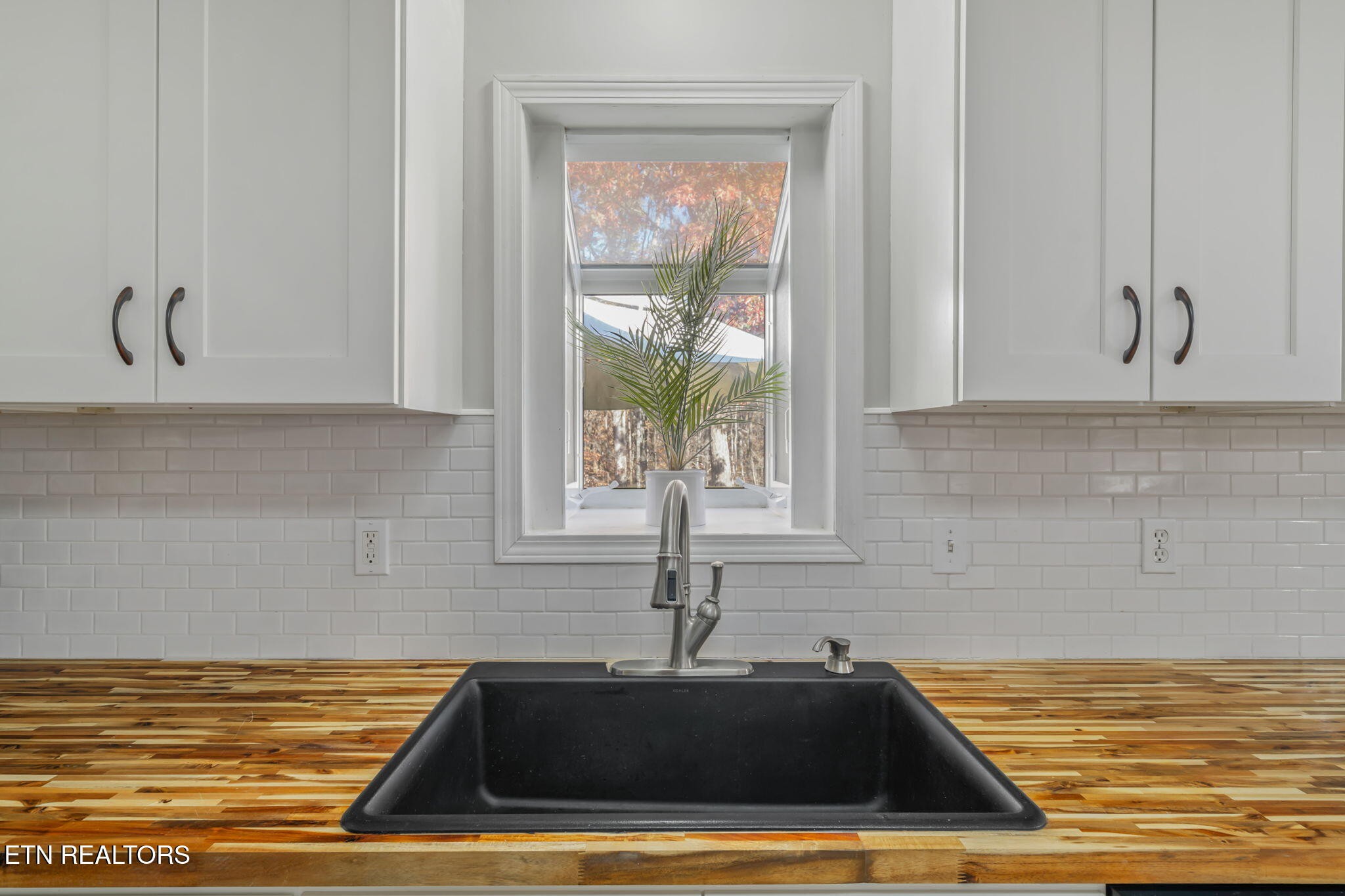 172 Edgewood Drive Powell, TN 37849 - Photo 14 of 29 a view of a sink and microwave in a kitchen