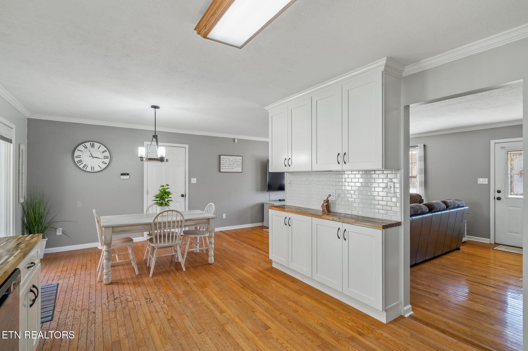 172 Edgewood Drive Powell, TN 37849 - Photo 15 of 29 a living room with stainless steel appliances granite countertop furniture wooden floor and a view of kitchen