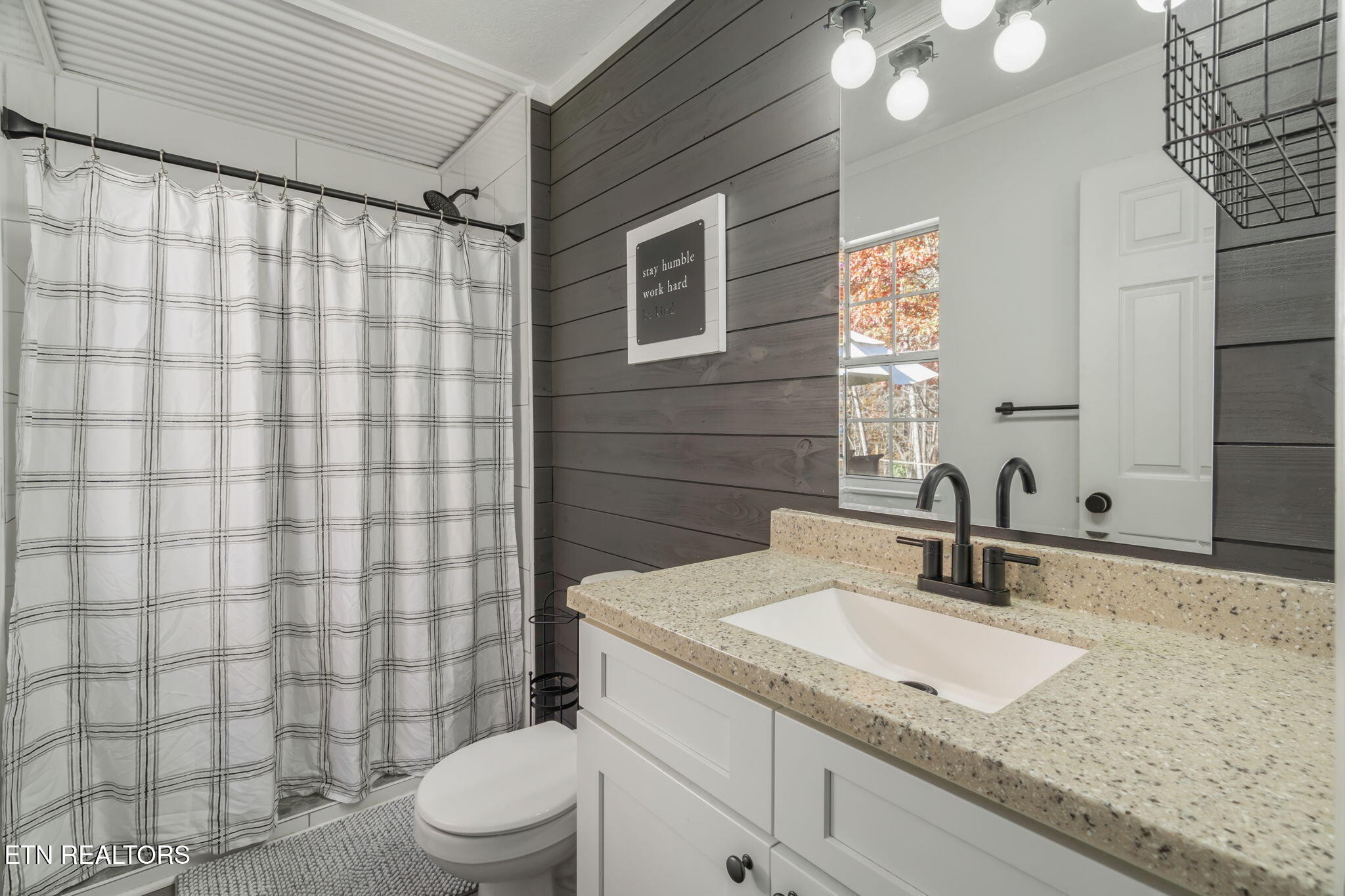 172 Edgewood Drive Powell, TN 37849 - Photo 17 of 29 a bathroom with a granite countertop sink toilet and shower