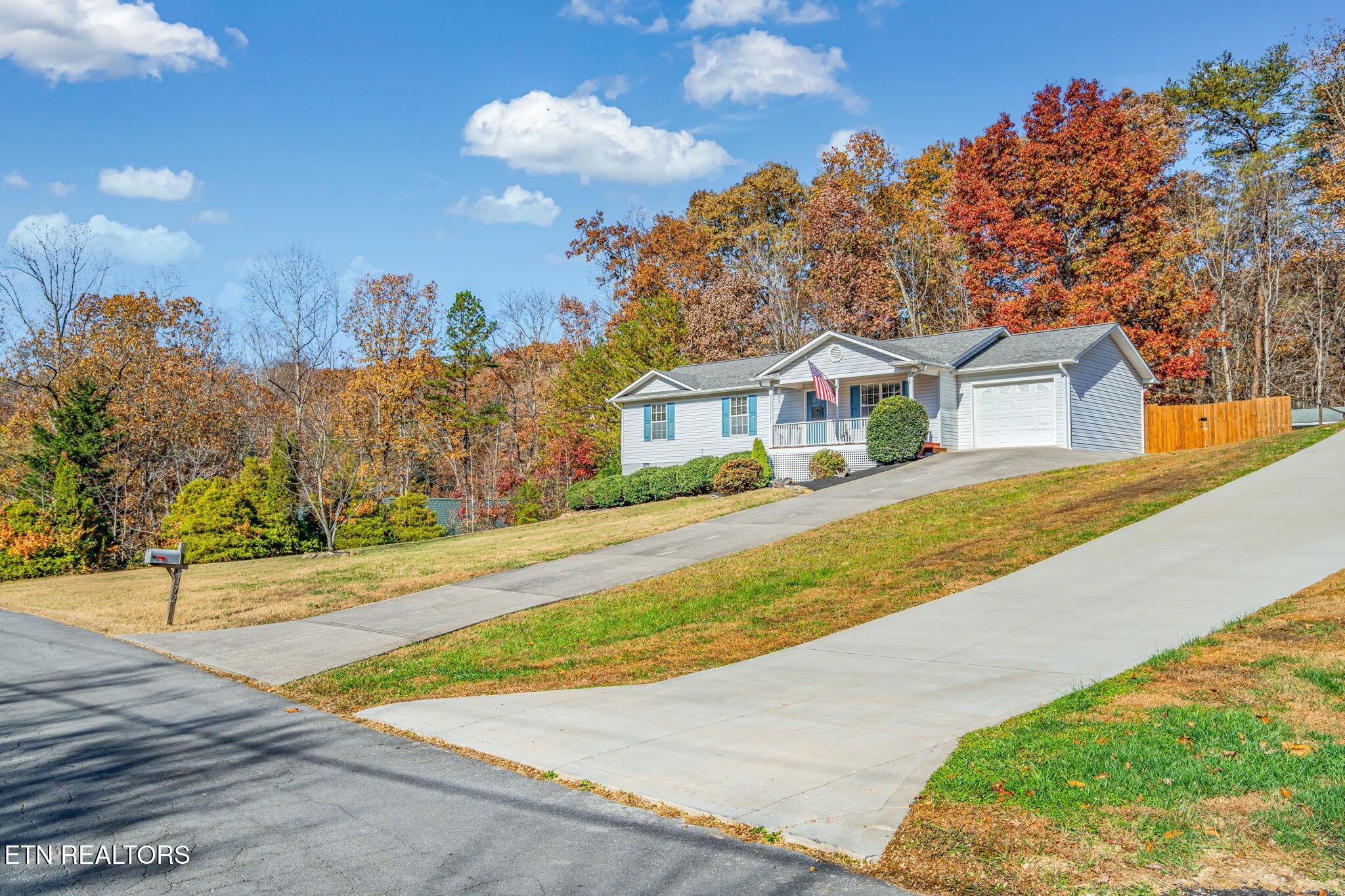 172 Edgewood Drive Powell, TN 37849 - Photo 2 of 29 a front view of a house with a yard and garage
