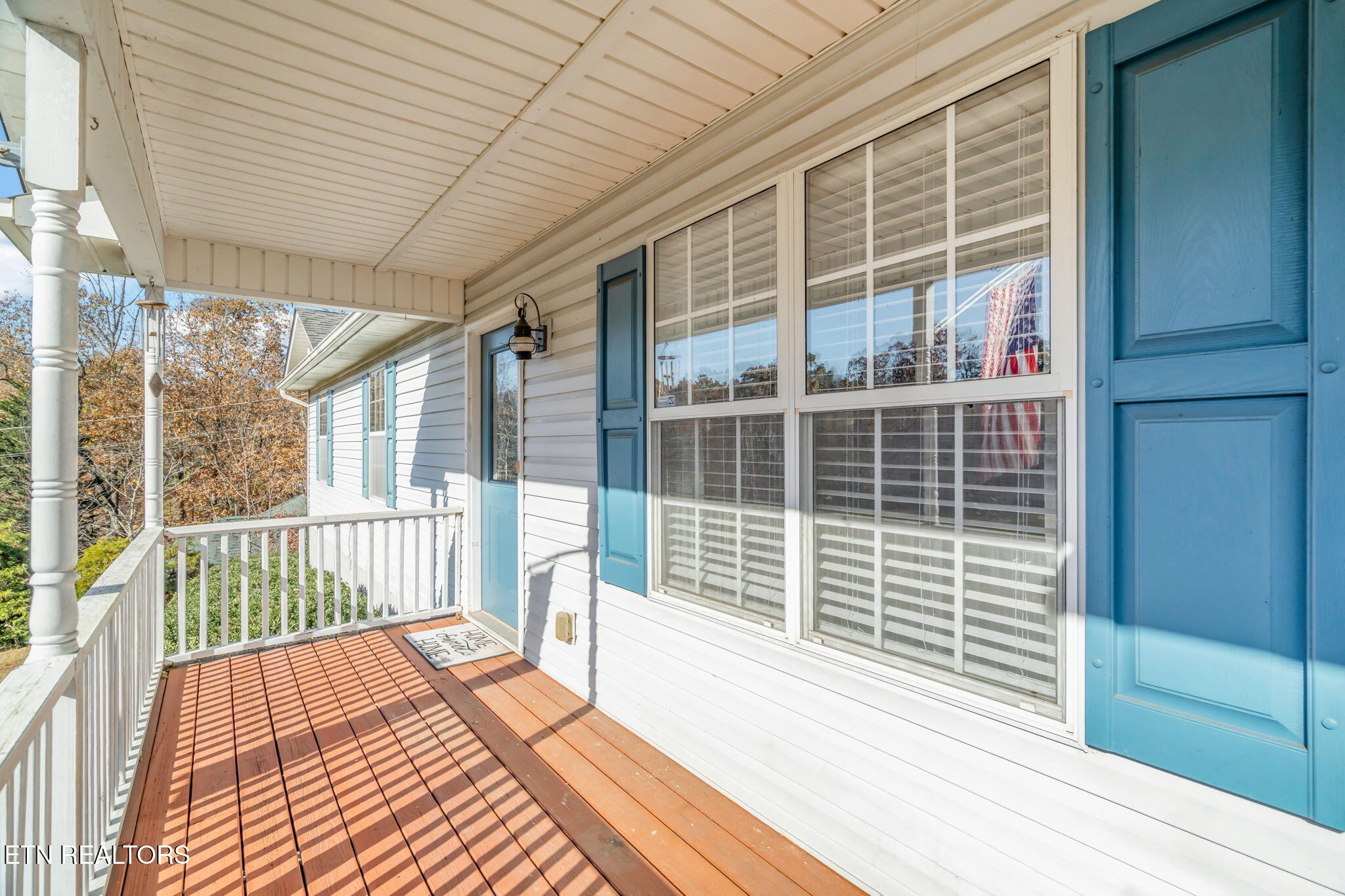 172 Edgewood Drive Powell, TN 37849 - Photo 5 of 29 a view of a balcony with a floor to ceiling window and wooden floor