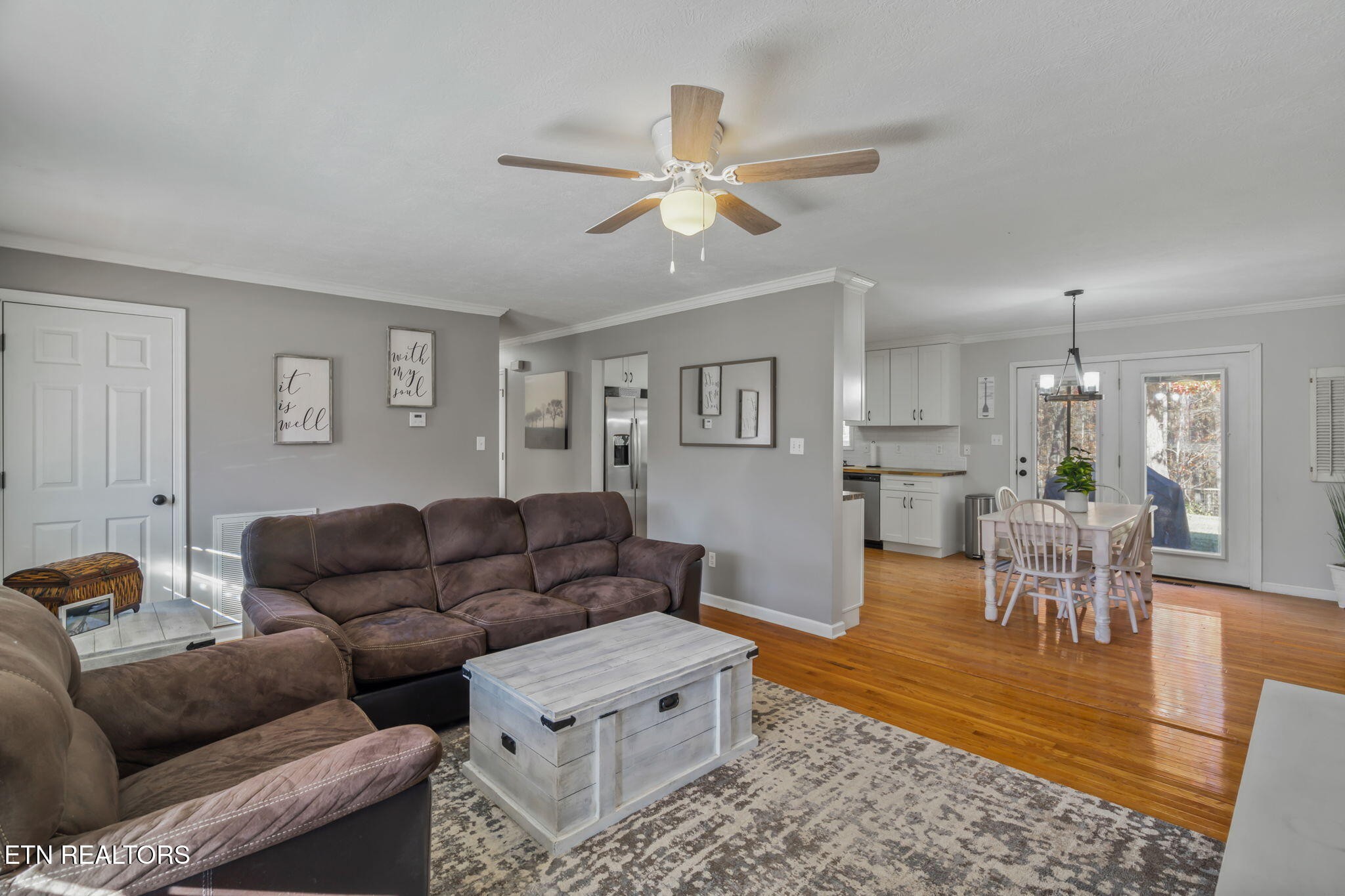 172 Edgewood Drive Powell, TN 37849 - Photo 8 of 29 a living room with furniture and a dining table with wooden floor