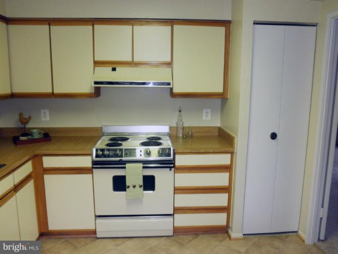 15100 Interlachen Drive, Unit 4111 Silver Spring, MD 20906 - Photo 11 of 28 Kitchen, Electric Stove and Pantry