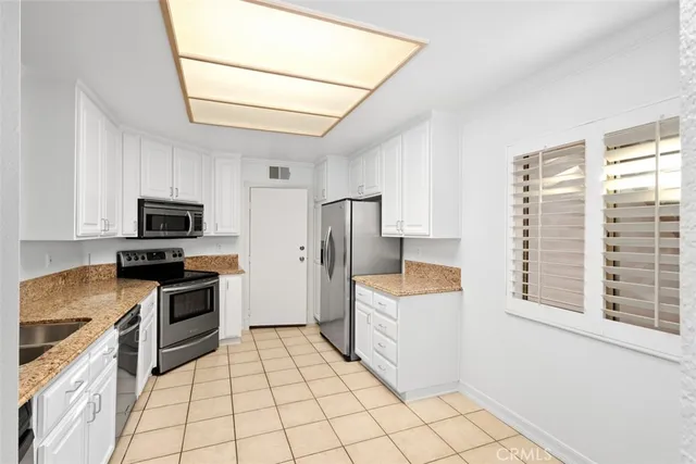 a view of a kitchen from the hallway