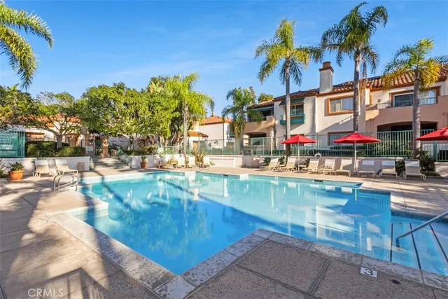 a view of a swimming pool with a table and chairs
