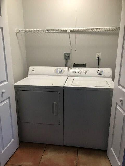 3405 Poolside Drive Greenacres, FL 33463 - Photo 12 of 32 a utility room with a washer dryer and washer
