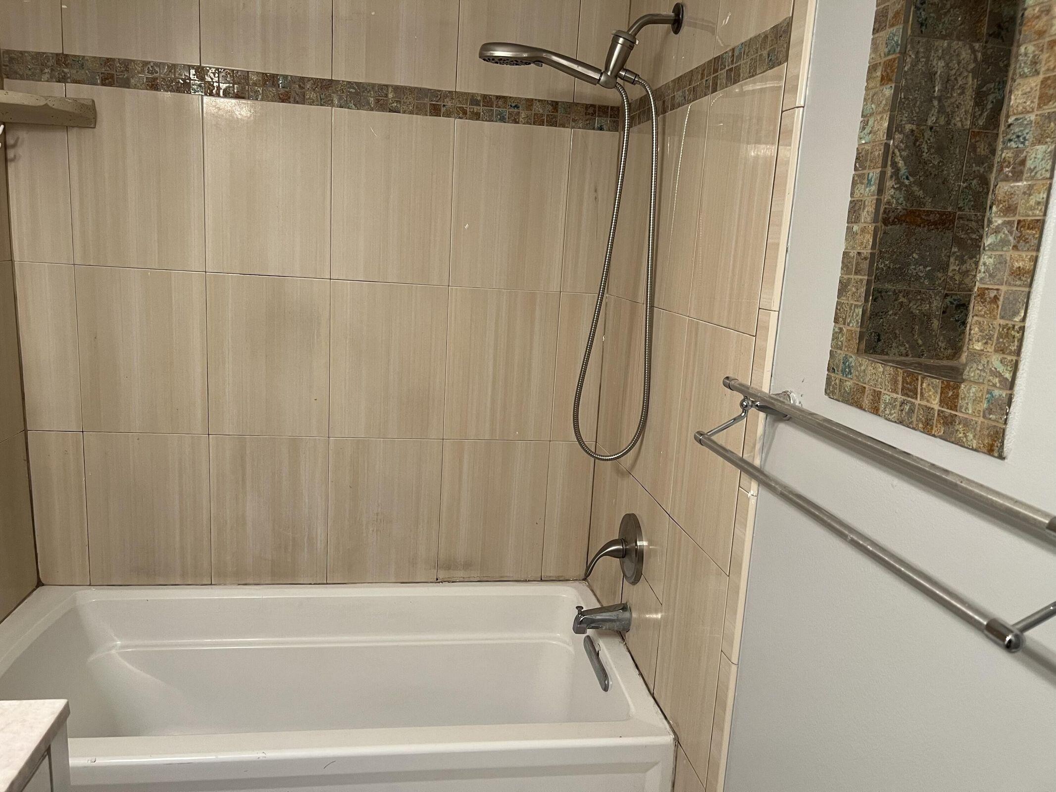 3405 Poolside Drive Greenacres, FL 33463 - Photo 8 of 32 a bathroom with a shower and a tub