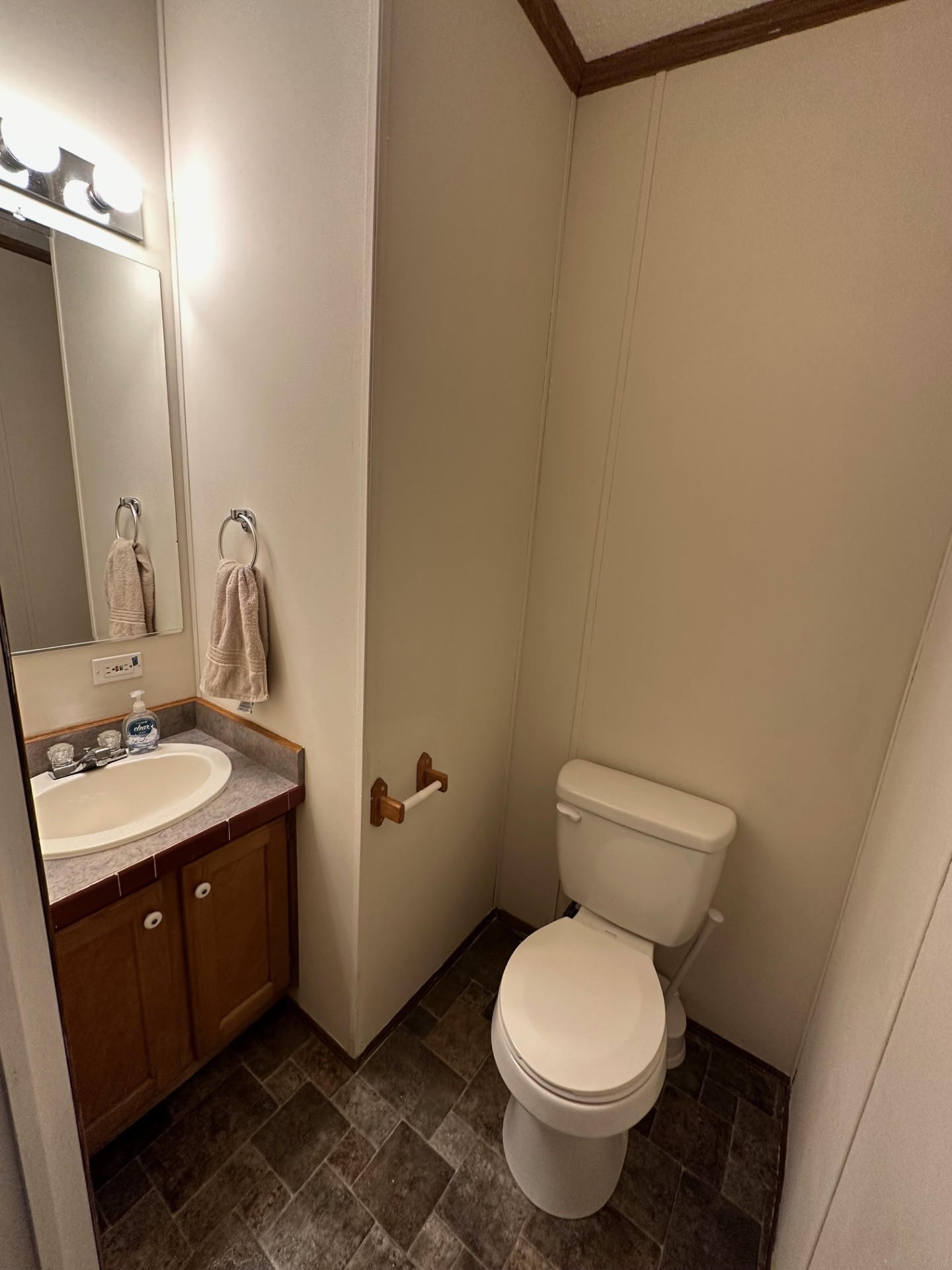 6448 Payne Road Portland, TN 37148 - Photo 13 of 28 a bathroom with a toilet sink and mirror