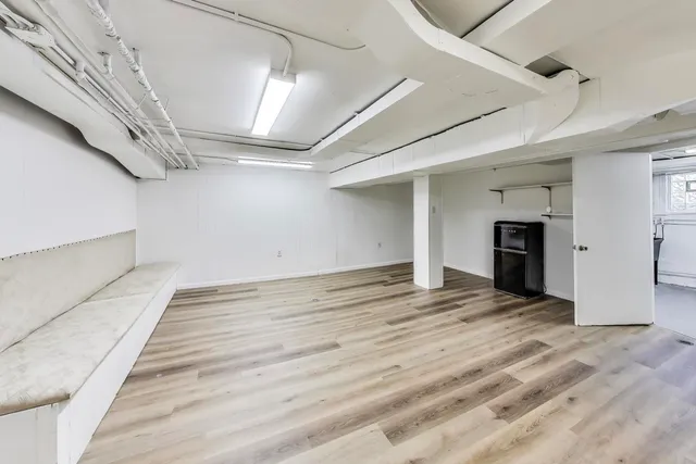 a view of a livingroom with wooden floor