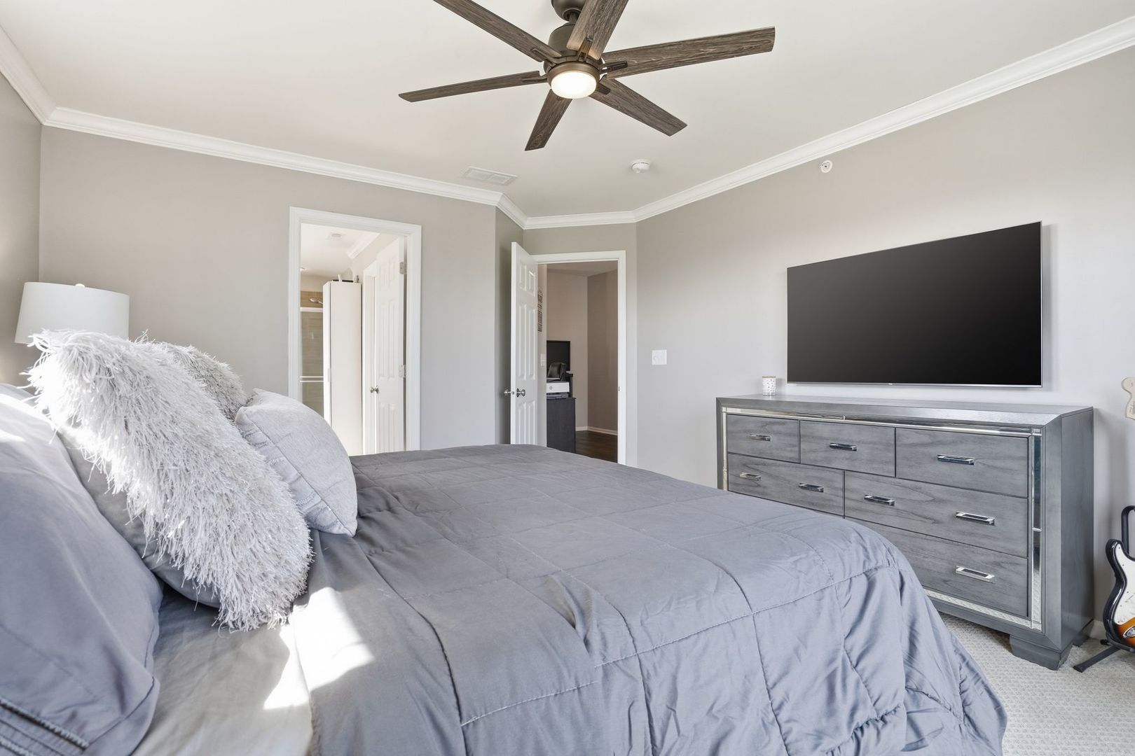 2925 Madison Drive Naperville, IL 60564 - Photo 16 of 37 a bedroom with a bed and a flat screen tv