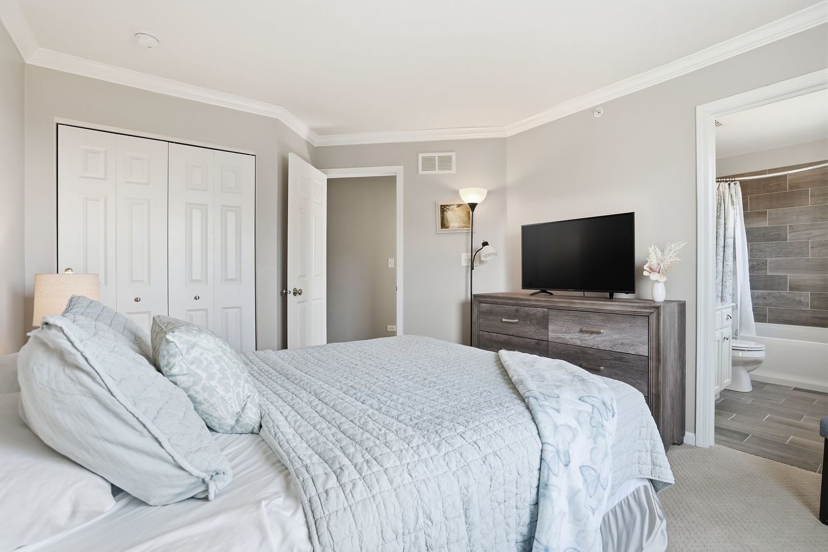 2925 Madison Drive Naperville, IL 60564 - Photo 23 of 37 a bedroom with a bed and a flat screen tv