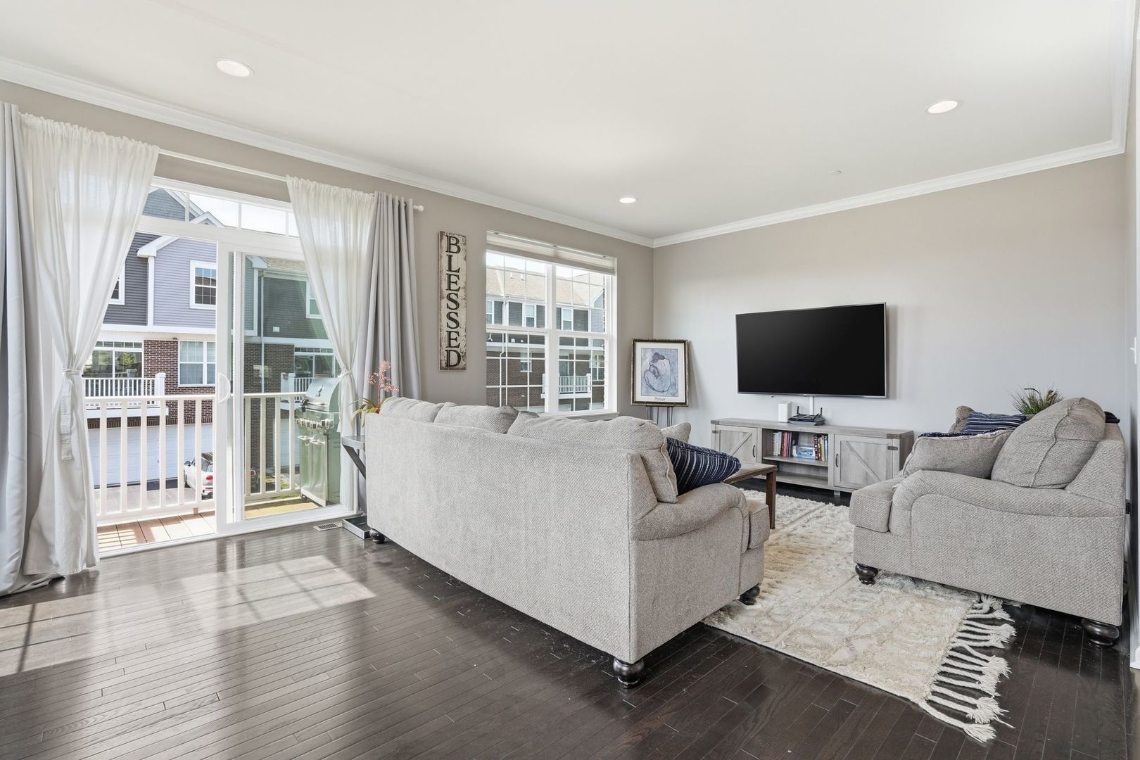 2925 Madison Drive Naperville, IL 60564 - Photo 5 of 37 a living room with furniture and a flat screen tv