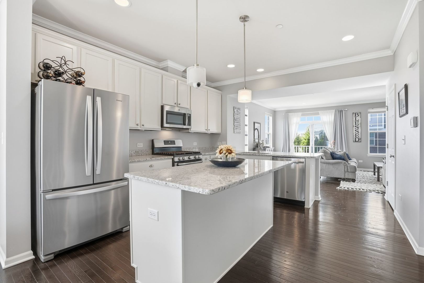 2925 Madison Drive Naperville, IL 60564 - Photo 6 of 37 a kitchen with stainless steel appliances a refrigerator a stove a sink dishwasher a oven with white cabinets and wooden floor
