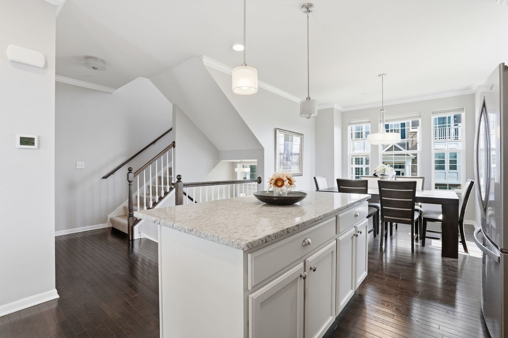 2925 Madison Drive Naperville, IL 60564 - Photo 7 of 37 a kitchen with stainless steel appliances granite countertop a kitchen island a stove a table and chairs