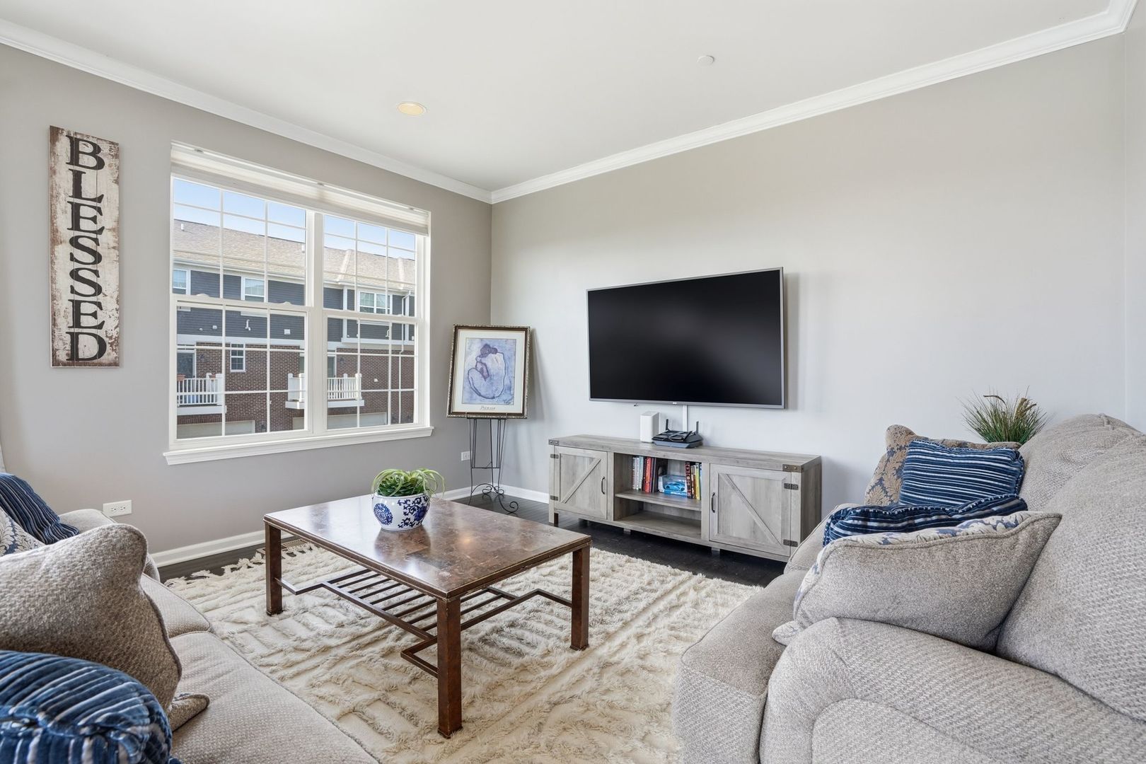 2925 Madison Drive Naperville, IL 60564 - Photo 9 of 37 a living room with furniture and a flat screen tv