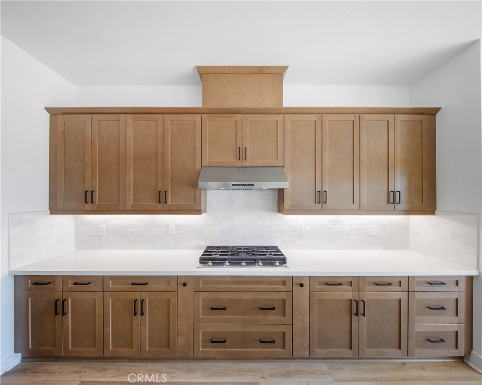 28632 Old Spgs Road Castaic, CA 91384 - Photo 17 of 70 a kitchen with granite countertop cabinets and stove