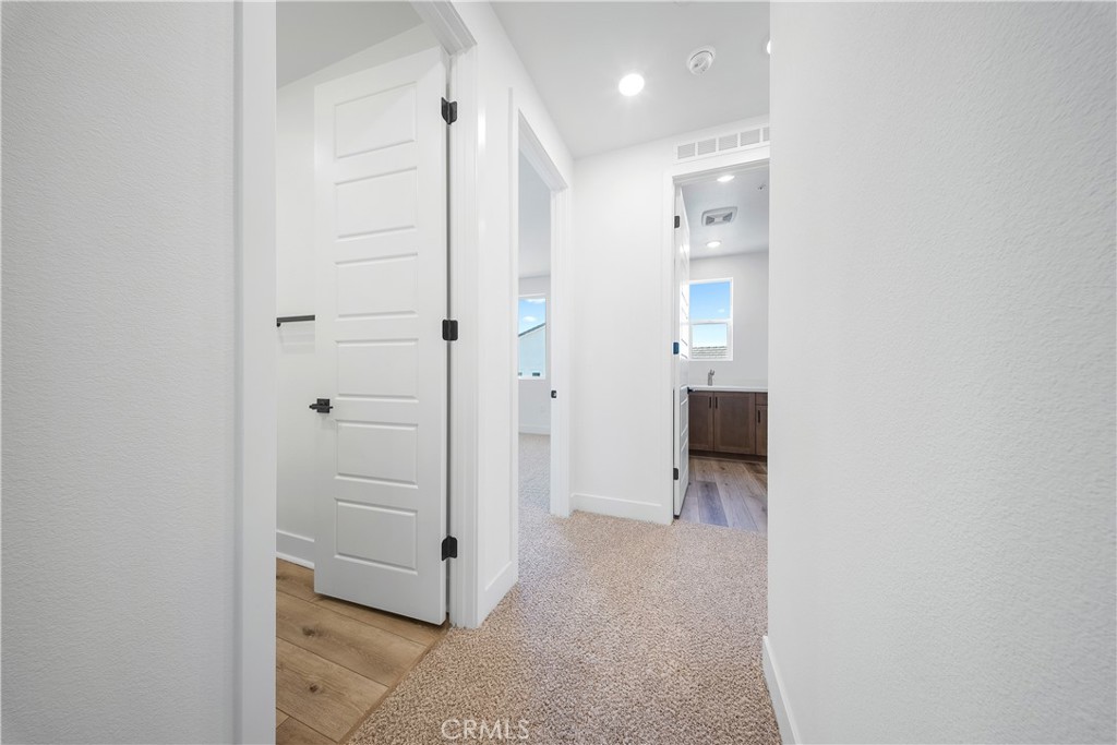 28632 Old Spgs Road Castaic, CA 91384 - Photo 43 of 70 a view of a hallway with wooden shelves
