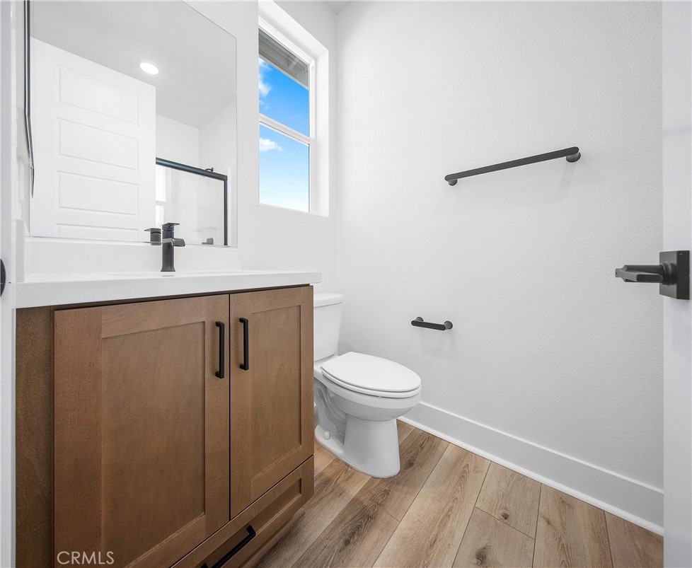 28632 Old Spgs Road Castaic, CA 91384 - Photo 51 of 70 a bathroom with a sink a toilet and mirror