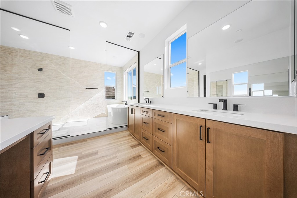 28632 Old Spgs Road Castaic, CA 91384 - Photo 57 of 70 a large white kitchen with a large counter top a sink stainless steel appliances and cabinets