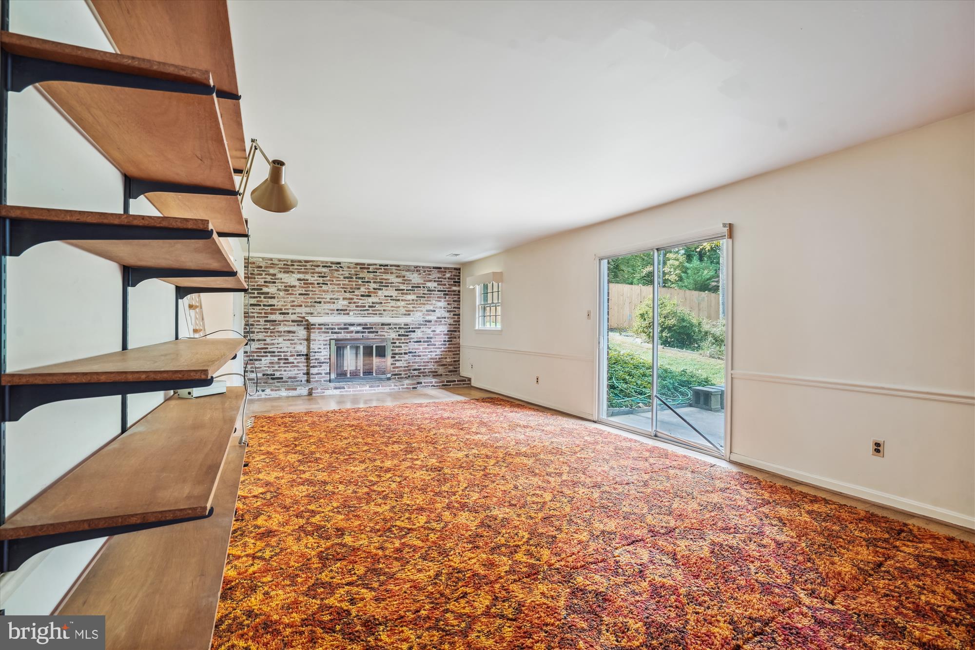 1391 Canterbury Way Potomac, MD 20854 - Photo 11 of 19 Family room fireplace & sliding glass door to yard
