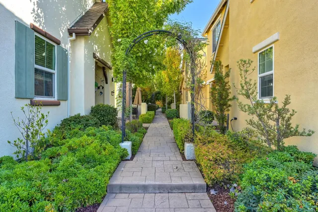 a view of a pathway with house on both side