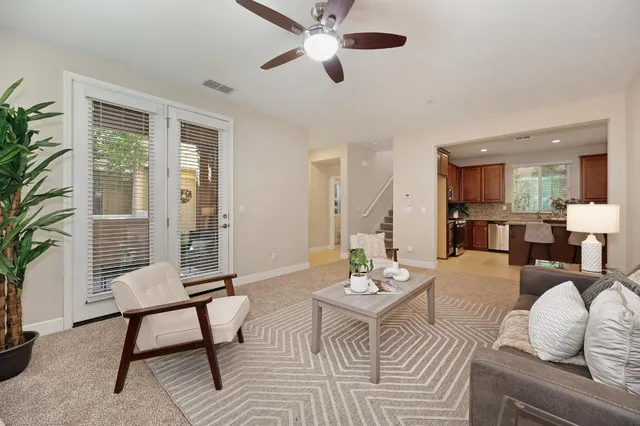 a living room with furniture and a window