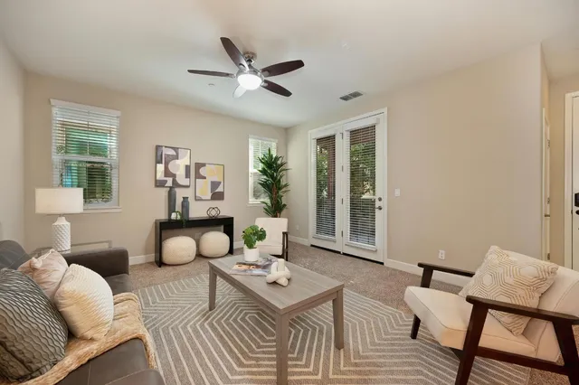 a living room with furniture and a window