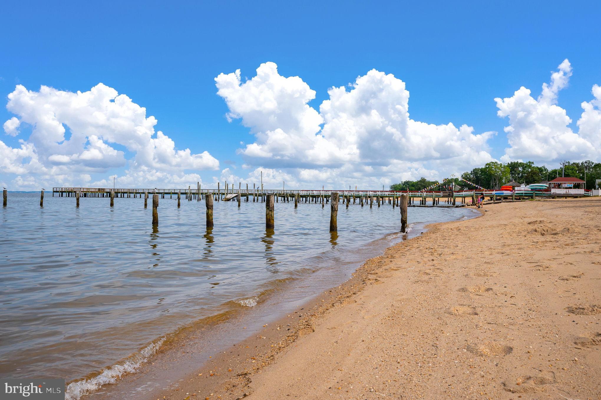 312 9th Street Colonial Beach, VA 22443 - Photo 48 of 62 Serene shoreline with a tranquil pier view.