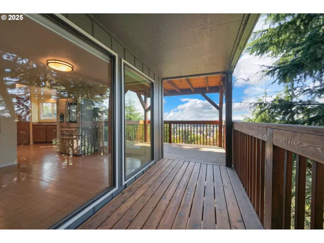 a balcony with wooden floor