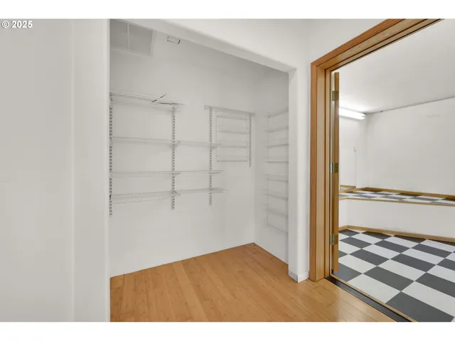 a bedroom with a bed and a cabinets