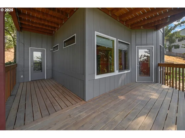 a view of outdoor space with deck and garden