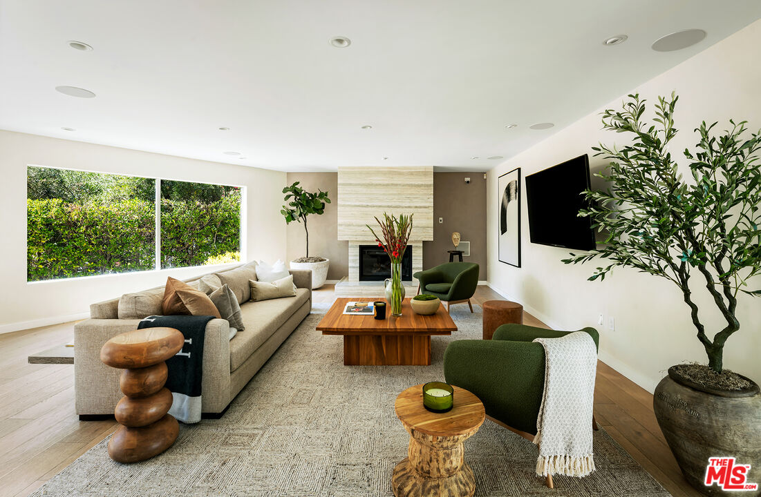1600 North Kings Road Los Angeles, CA 90069 - Photo 1 of 37 a living room with furniture and a flat screen tv