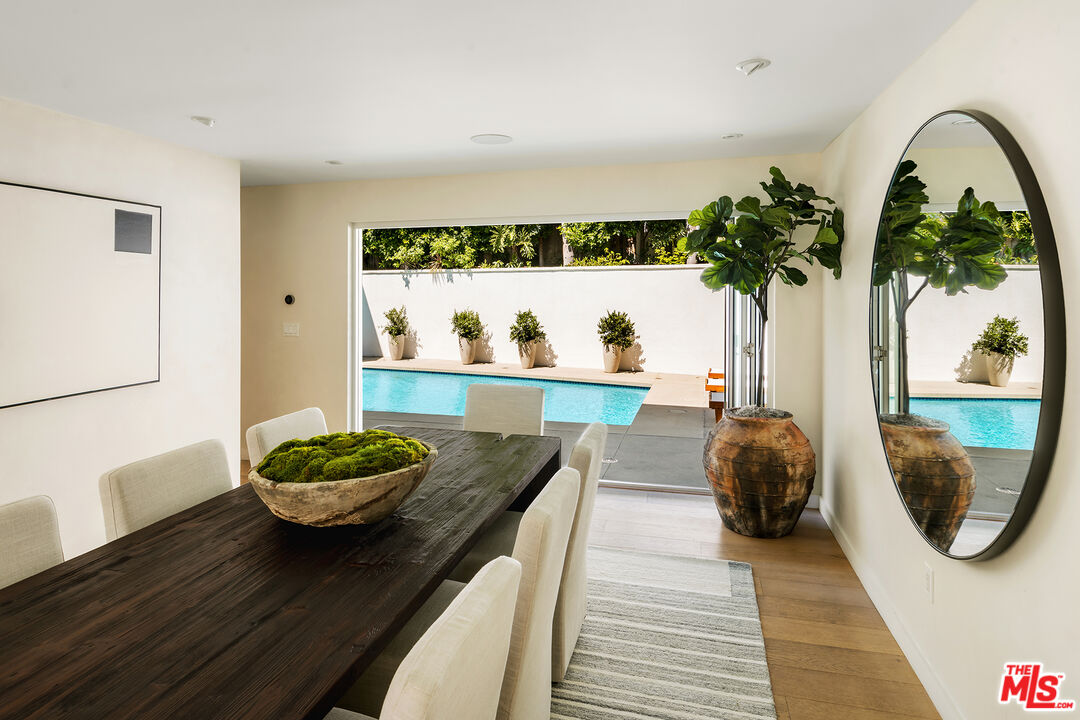 1600 North Kings Road Los Angeles, CA 90069 - Photo 13 of 37 a living room with a couch and a potted plant