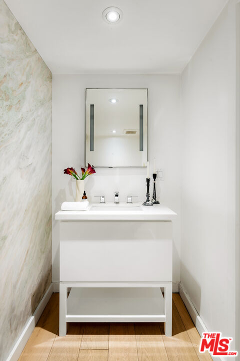 1600 North Kings Road Los Angeles, CA 90069 - Photo 17 of 37 a bathroom with a sink and a mirror