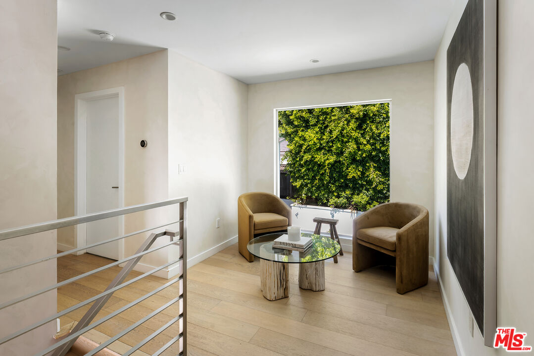 1600 North Kings Road Los Angeles, CA 90069 - Photo 18 of 37 a living room with furniture and a window