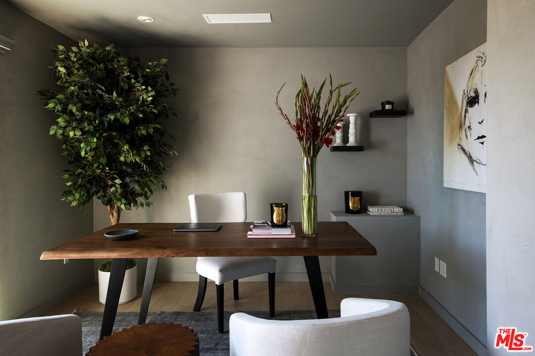 1600 North Kings Road Los Angeles, CA 90069 - Photo 21 of 37 a workspace with furniture and a potted plant