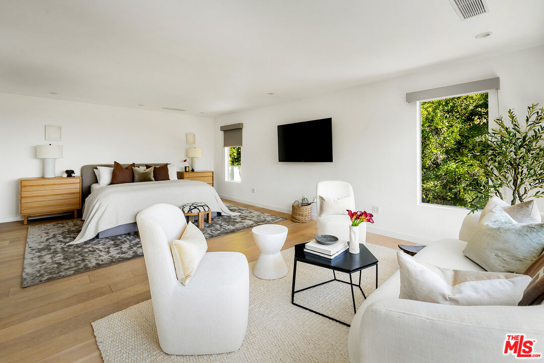 1600 North Kings Road Los Angeles, CA 90069 - Photo 25 of 37 a living room with furniture and a flat screen tv