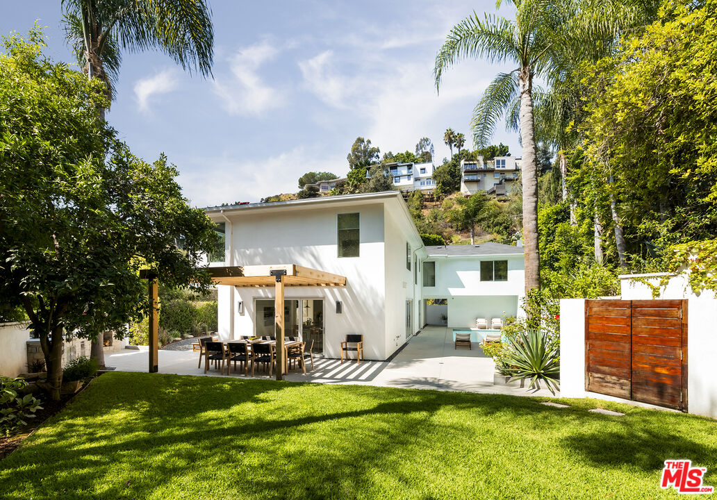 1600 North Kings Road Los Angeles, CA 90069 - Photo 29 of 37 a view of a house with swimming pool and sitting area