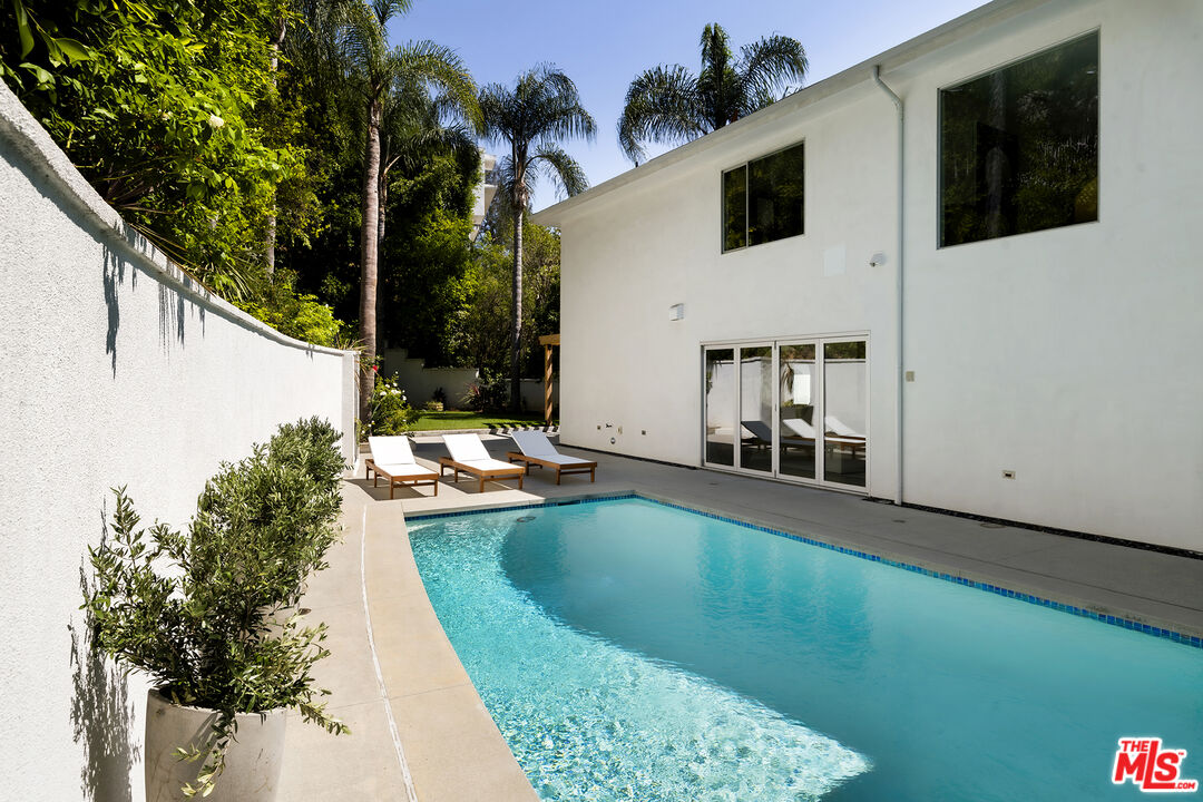 1600 North Kings Road Los Angeles, CA 90069 - Photo 35 of 37 a view of swimming pool with a patio