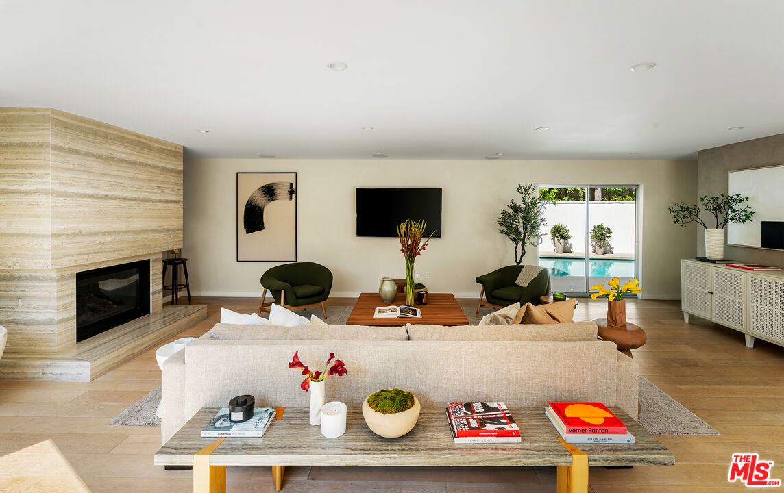 1600 North Kings Road Los Angeles, CA 90069 - Photo 6 of 37 a room with furniture and a fireplace