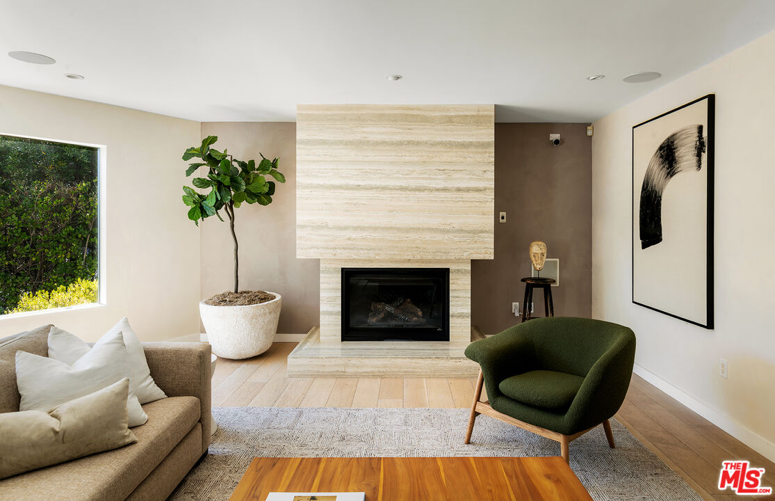 1600 North Kings Road Los Angeles, CA 90069 - Photo 7 of 37 a living room with furniture and a fireplace