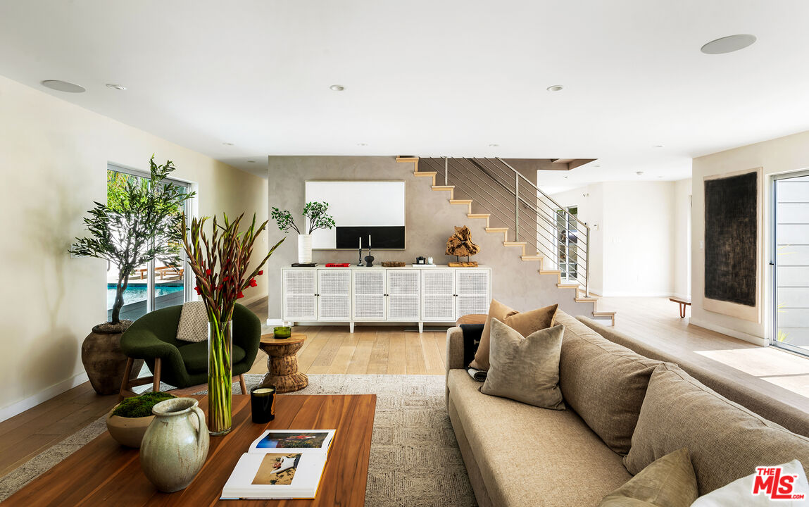 1600 North Kings Road Los Angeles, CA 90069 - Photo 8 of 37 a living room with furniture and a potted plant