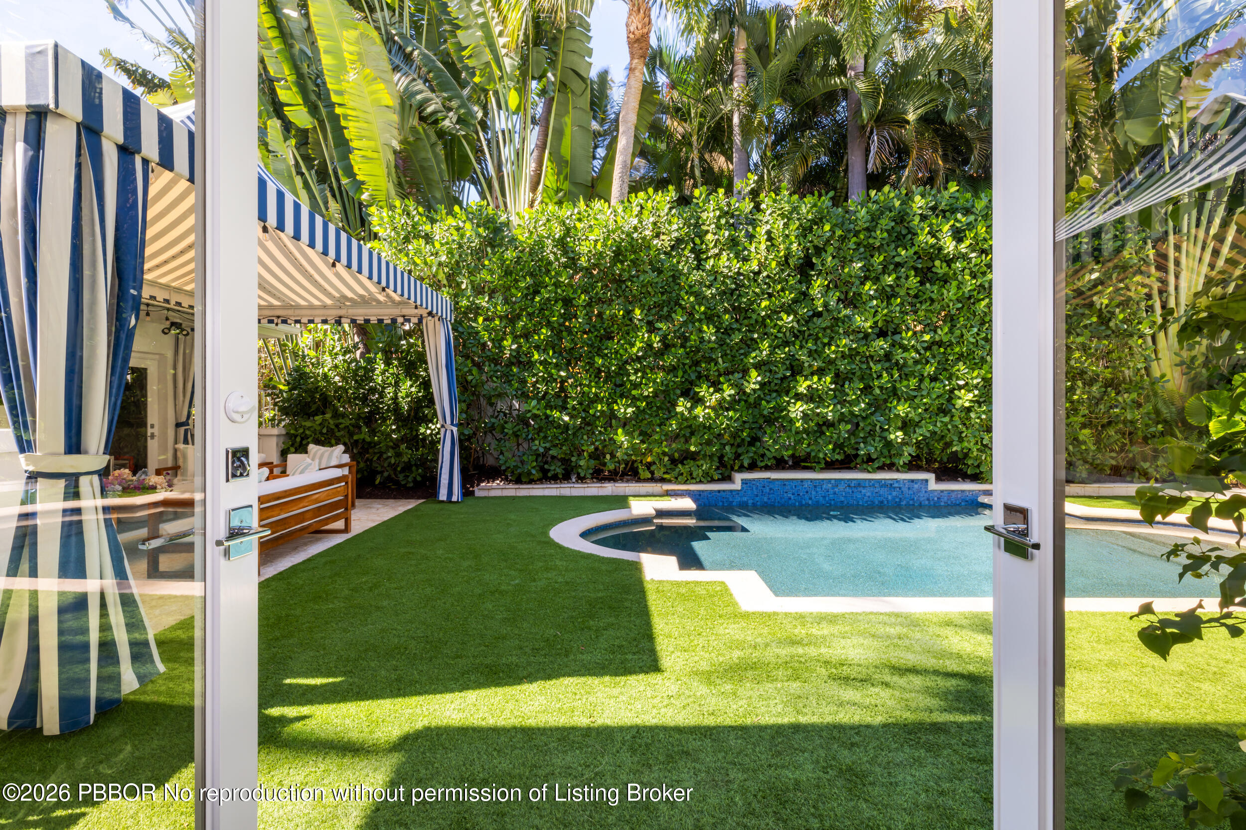 121 Seville Road West Palm Beach, FL 33405 - Photo 57 of 67 a view of a swimming pool with a yard